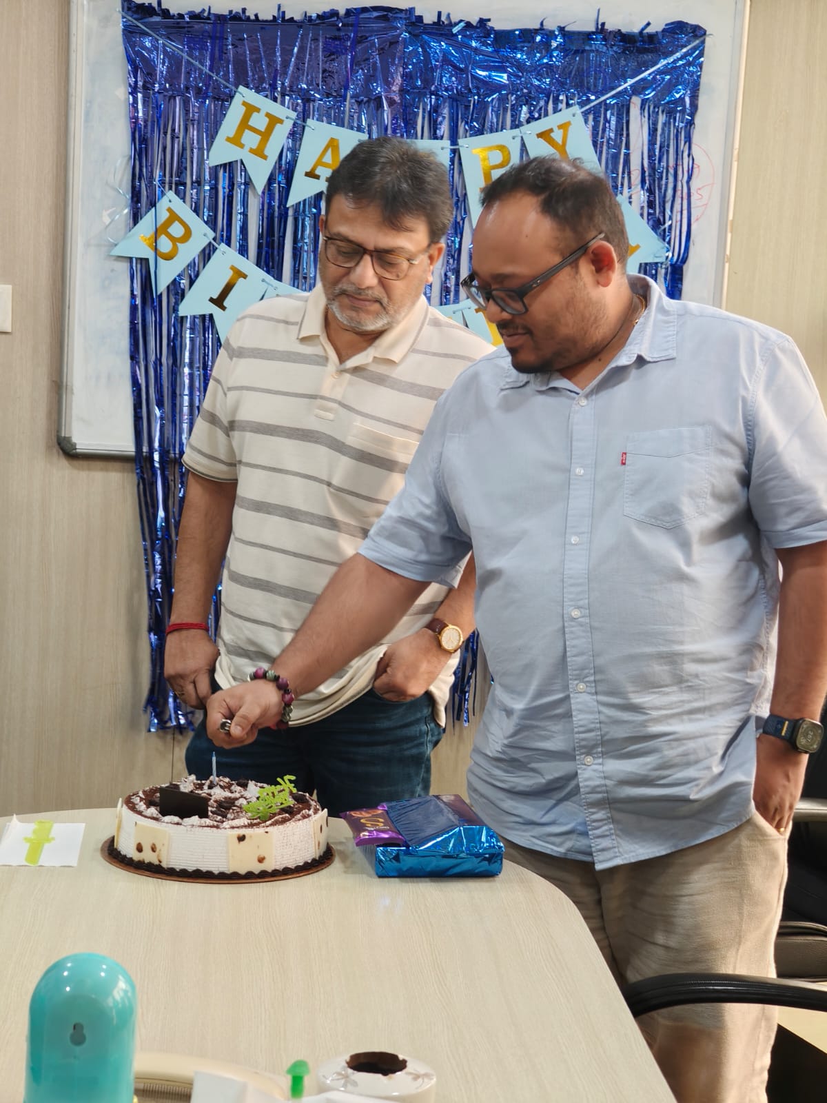 CEO lighting birthday candle